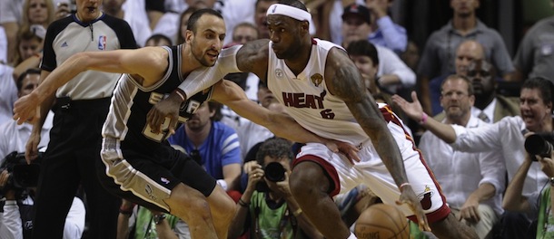 Le Bron James (R) of the Miami Heat drives against Manu Ginobili (L) of the San Antonio Spurs in the fourth quarter during Game 6 of the NBA Finals against the Miami Heat at the American Airlines Arena June 19, 2013 in Miami, Florida. Miami defeated San Antonio 103-100 in overtime to even the best-of-seven championship series 3-3. AFP PHOTO / Brendan SMIALOWSKI (Photo credit should read BRENDAN SMIALOWSKI/AFP/Getty Images)