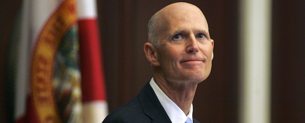 Gov. Rick Scott smiles as he receives applause during his State of the State address Tuesday, March 5, 2013, in the Florida House of Representatives in Tallahassee, Fla. The Florida Legislature convened today for its annual 60-day session. (AP Photo/Phil Sears)