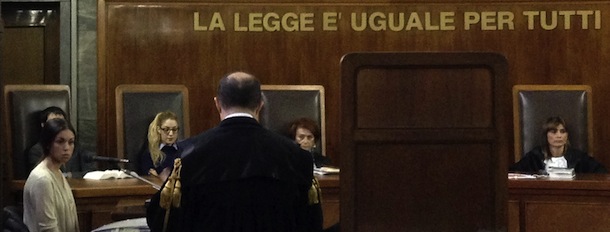 This picture taken with a smartphone shows Moroccan-born Karima El-Mahroug, nicknamed "Ruby the Heart Stealer" (L), during a session of former Prime Minister Silvio Berlusconi's trial for having sex with an underage prostitute and abuse of office on May 24, 2013 at Milan's tribunal.The hearing is one of the last in a trial that began two years ago and relates to alleged crimes in 2010 when Berlusconi was still prime minister and revolves around alleged raunchy "bunga bunga" parties at his luxury residence outside Milan. AFP PHOTO / OLIVIER MORIN BEST QUALITY AVAILABLE (Photo credit should read OLIVIER MORIN/AFP/Getty Images)