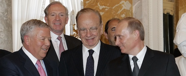 Russian President Vladimir Putin, right, shakes hands with New England Patriots owner Robert Kraft, left , while holding Kraft's diamond-encrusted 2005 Super Bowl ring, as News Corp. Chairman Rupert Murdoch, center, looks on during a meeting of American business executives at the 18th century Konstantin Palace outside St. Petersburg, Russia, Saturday, June 25, 2005. Kraft showed the ring to Putin _ who tried it on, put it in his pocket and left, said Russian news reports. It isn't clear yet if Kraft, whose business interests also include paper and packaging companies and venture capital investments, intended that Putin keep the ring. (AP Photo/Alexander Zemlianichenko,file)