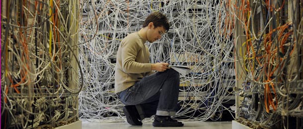 An engineer checks communication cables in the Media Gateway (MGW) lab simulating translation between disparate telecommunications networks in Ericsson's research and development center in Budapest, Hungary, Tuesday, Feb. 24, 2009. Ericsson is one of the largest Swedish companies, a leading provider of telecommunication and data communication systems, and related services covering a range of technologies, including especially mobile networks. (AP Photo/Bela Szandelszky)