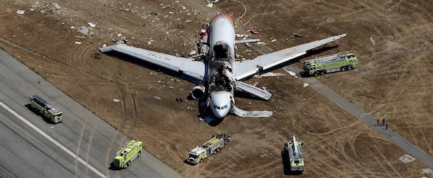 SAN FRANCISCO, CA - JULY 06: A Boeing 777 airplane lies burned on the runway after it crash landed at San Francisco International Airport July 6, 2013 in San Francisco, California. An Asiana Airlines passenger aircraft coming from Seoul, South Korea crashed while landing. There has been no official confirmation of casualties. (Photo by Ezra Shaw/Getty Images)