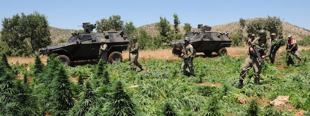 Turkish soldiers take position in a marijuana field during an operation on July 8, 2013 in the Lice district of the southeastern city of Diyarbakir. AFP PHOTO /MEHMET ENGIN (Photo credit should read MEHMET ENGIN/AFP/Getty Images)