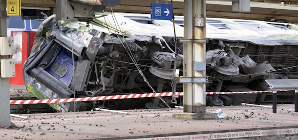 A picture shows a derailed wagon on the site of a train accident in the railway station of Bretigny-sur-Orge on July 12, 2013 near Paris. A train derailed in the Paris suburb of Bretigny-sur-Orge in an accident that caused "many casualties", authorities said. AFP PHOTO /KENZO TRIBOUILLARD (Photo credit should read KENZO TRIBOUILLARD/AFP/Getty Images)