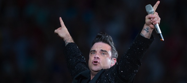 British singer Robbie Williams performs on stage on July 13, 2013 at the Amsterdam Arena, as part of his his "Take the Crown Stadium Tour 2013" in the Amsterdam. AFP PHOTO / ANP / FERDY DAMMAN (Photo credit should read Ferdy Damman/AFP/Getty Images)