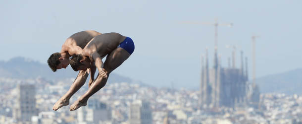 Germany's Klein Sascha and Patrick Hausding compete in the men's 10-metre synchro platform final diving event in the FINA World Championships at the Piscina Municipal de Montjuic in Barcelona on July 21, 2013. AFP PHOTO / LLUIS GENE (Photo credit should read LLUIS GENE/AFP/Getty Images)