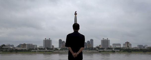 A North Korean man looks at the Ju Che Tower from Kim Il Sung Square on Sunday, July 21, 2013, downtown Pyongyang, North Korea. The country is preparing to mark the 60th anniversary of the end of the Korean War. (AP Photo/Wong Maye-E)
