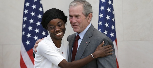 Former President George W. Bush, right, posses for a photo with Mondell Bernadette Avril after she was sworn in as a U.S. citizen during a ceremony at the The George W. Bush Presidential Center in Dallas, Wednesday, July 10, 2013. Twenty new citizens took the oath of U.S. citizenship at the former president's library. (AP Photo/LM Otero)
