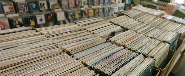 In this Sept. 20, 2012 photo, rows and rows of albums are seen at Rainbow Records in Barrington, Ill. Longtime owner John Thominet is a true vinyl junkie. Since his first purchase of “Surfin’ Safari” by The Beach Boys as a 9-year-old, he’s been hopelessly hooked on wax tracks. His store is jammed with thousands of LPs, new and used, a veritable candy store for record addicts. (AP Photo/Daily Herald, Bob Chwedyk) MANDATORY CREDIT, MAGS OUT