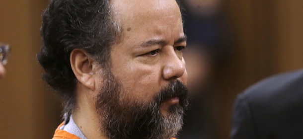 Ariel Castro stands before a judge during his arraignment on an expanded 977-count indictment Wednesday, July 17, 2013, in Cleveland. Castro is charged with kidnapping and raping three women over a decade in his Cleveland home. Castro pleaded not guilty to 512 counts of kidnapping and 446 counts of rape. (AP Photo/Tony Dejak)
