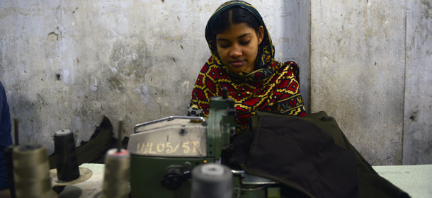 A Bangladeshi woman works in a small garments factory during a nationwide strike called by the Bangladesh Nationalist Party (BNP) on the outskirts of Dhaka, on May 29, 2013. The nationwide whole-day strike called by the BNP-led 18-Party alliance started at 6am on Wednesday amidst tight security. AFP PHOTO/Munir uz ZAMAN (Photo credit should read MUNIR UZ ZAMAN/AFP/Getty Images)
