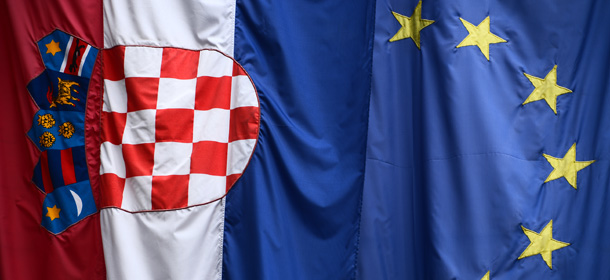 The European Union flag (R) and the Croatian national flag are seen in Zagreb on June 30, 2013. Croatia began the countdown on Sunday to its entry into the European Union as the group's 28th member, with celebrations planned to mark the historic step despite worries over the parlous state of the economy. AFP PHOTO / DIMITAR DILKOFF (Photo credit should read DIMITAR DILKOFF/AFP/Getty Images)
