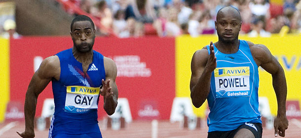 US Tyson Gay (L) runs to win the battle against Jamaica's Asafa Powell (R) in the mens 100m final at the Aviva British Grand Prix on July 10, 2010. AFP PHOTO/Derek Blair (Photo credit should read Derek Blair/AFP/Getty Images)