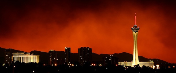 Smoke from the Carpenter 1 fire in the Spring Mountains range billows behind hotel-casinos on the Las Vegas Strip on July 8, 2013 in Las Vegas, Nevada. More than 15,000 acres have burned since lightning sparked the blaze in Carpenter Canyon on the Pahrump, Nevada side of Mount Charleston on July 1. More than 750 firefighters are battling the wildfire which crested the peak of Mount Charleston on Thursday, prompting the evacuation of 520 people as it began descending the east side of the mountain, about 35 miles northwest of Las Vegas. The fire is 15% contained and fire officials estimate that they won't have it fully contained until July 19.