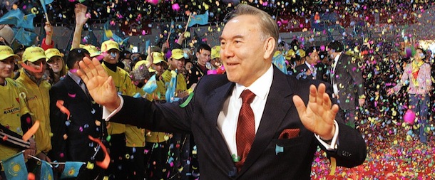 Astana, KAZAKHSTAN: Kazakh President Nursultan Nazarbayev waves to supporters after his landslide victory in 04 December's presidential election was officially announced in Astana, 05 December 2005. Kazakhstan's presidential election was free and fair, the country's top election official said 05 December after Western observers issued a damning report on the poll. The election, in which veteran leader Nursultan Nazarbayev won a landslide re-election, was "transparent, free, competitive and fair," Onalysn Zhumabekov, chairman of the Central Election Commission, told journalists. AFP POOL / KAZAKH PRESIDENTIAL PRESS SERVICE (Photo credit should read STRINGER/AFP/Getty Images)