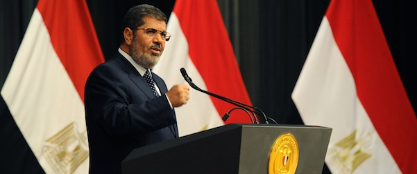 CORRECTS DATE - In this Wednesday, June 26, 2013 image released by the Egyptian Presidency, Egyptian President Mohammed Morsi delivers a speech, in Cairo, Egypt. Morsi told his opponents to use elections not protests to try to change the government and said the military should focus on its role as the nation's defenders in a nationally televised address on Wednesday, days before the opposition plans massive street rallies aimed at removing him from office. (AP Photo/Egyptian Presidency)