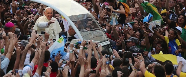 RIO DE JANEIRO, BRAZIL - JULY 22: Pope Francis waves to the crowd while departing the Metropolitan Cathedral in the Popemobile after arriving in Rio on July 22, 2013 in Rio de Janeiro, Brazil. More than 1.5 million pilgrims are expected to join Pope Francis for his visit to the Catholic Church's World Youth Day celebrations. Pope Francis is scheduled to visit Brazil from July 22 to 28. (Photo by Mario Tama/Getty Images)