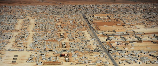 An aerial view shows the Zaatari refugee camp on July 18, 2013 near the Jordanian city of Mafraq, some 8 kilometers from the Jordanian-Syrian border. The northern Jordanian Zaatari refugee camp, now home to 160,000 Syrians, equal in size to what would be Jordan's fifth-largest city. AFP PHOTO/MANDEL NGAN/POOL (Photo credit should read MANDEL NGAN/AFP/Getty Images)