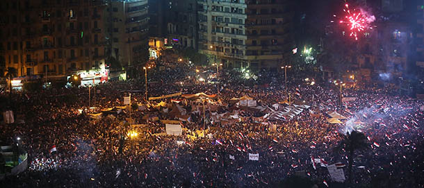 CAIRO, EGYPT - JULY 03: Tens of thousands of Egyptian protesters celebrate in Tahrir Square as the deadline given by the military to Egyptian President Mohammed Morsi passes on July 3, 2013 in Cairo, Egypt. The president gave a defiant speech last night and vowed to stay in power despite the military threats. As unrest spreads throughout the country, at least 23 people were killed in Cairo on Tuesday and over 200 others were injured. It has been reported that the military has taken over the state television. (Photo by Spencer Platt/Getty Images)