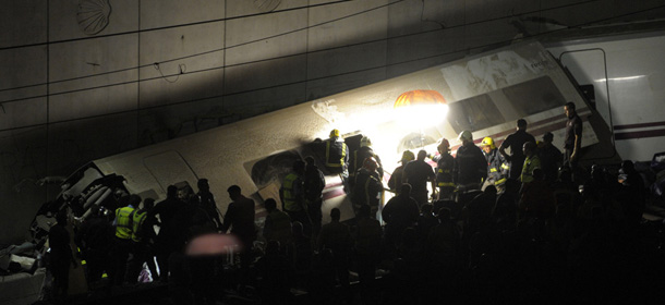 Rescuers work on the site of a train accident near the city of Santiago de Compostela on July 24, 2013. Up to a 20 people died when a train derailed in northwestern Spain today, media reports quoting witnesses said. The train which carried 238 passengers originated in Madrid and was bound for the northwestern town of Ferrol. AFP PHOTO / MIGUEL RIOPA (Photo credit should read MIGUEL RIOPA/AFP/Getty Images)