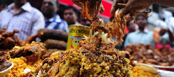 Bangladeshi street vendors prepare Iftar, food for breaking the daytime fast, at a traditional Iftar bazaar in the old part of Dhaka on July 21 , 2012, on the first day of Ramadan, the holy fasting month of Islam. Like millions of Muslim around the world, Bangladeshi Muslims celebrated the month of Ramadan by abstaining from eating, drinking, and smoking as well as sexual activities from dawn to dusk. AFP PHOTO/Munir uz ZAMAN (Photo credit should read MUNIR UZ ZAMAN/AFP/GettyImages)