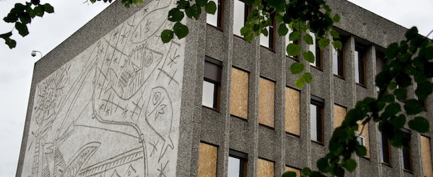 Windows are boarded up on the government quarter's "Y" building with Picasso's mural art work "The Fisherman" in Oslo, Norway on August 6, 2013. The art work survived the 22nd July 2011 bombing unscathed, but other government buildings bearing the artist's murals were severely damaged. The Norwegian Directorate for Cultural Heritage fears that Picasso's first monumental concrete murals, which were made between the late 1950s and the early 1970s for two government buildings in Oslo, may be destroyed. The buildings were severely damaged during the deadly terrorist attack in the Norwegian capital in July 2011. The government is now considering whether to demolish the Modernist buildings that form the regjeringskvartal or government quarter. AFP PHOTO / ODD ANDERSEN