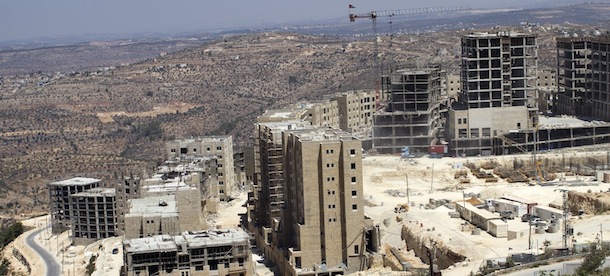 TO GO WITH AFP STORY BY CLEMENS WORTMANN 
A picture taken on August, 6, 2013 shows buildings under construction in the new city of Rawabi, between Ramallah and Nablus in the north of the Westbank. Rawabi, that includes homes for at least 25.000 residents, and perhaps in the end even 40.000, is the first planned city of its kind and the largest privately-funded development project in Palestinian history. AFP PHOTO/AHMAD GHARABLI (Photo credit should read AHMAD GHARABLI/AFP/Getty Images)