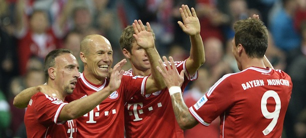 (L-R) Bayern Munich's French midfielder Franck Ribery, Dutch midfielder Arjen Robben, striker Thomas Mueller and Croatian striker Mario Mandzukic celebrate after the second goal for Munich during the German first division Bundesliga football match FC Bayern Munich vs Borussia Moenchengladbach in Munich, southern Germany on August 9, 2013.
AFP PHOTO / CHRISTOF STACHE

RESTRICTIONS - DFL RULES TO LIMIT THE ONLINE USAGE DURING MATCH TIME TO 15 PICTURES PER MATCH. FOR FURTHER QUERIES PLEASE CONTACT DFL DIRECTLY AT + 49 69 650050. (Photo credit should read CHRISTOF STACHE/AFP/Getty Images)