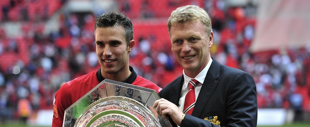 Manchester United's Dutch striker Robin Van Persie (L) and Scottish manager David Moyes (R) celebrate with the trophy after beating Wigan Athletic to win the FA Community Shield football match between Manchester United and Wigan Athletic at Wembley Stadium in north London on August 11, 2013. Manchester United's Dutch striker Robin van Persie scored both goals in their 2-0 victory. AFP PHOTO / GLYN KIRK

NOT FOR MARKETING OR ADVERTISING USE / RESTRICTED TO EDITORIAL USE (Photo credit should read GLYN KIRK/AFP/Getty Images)