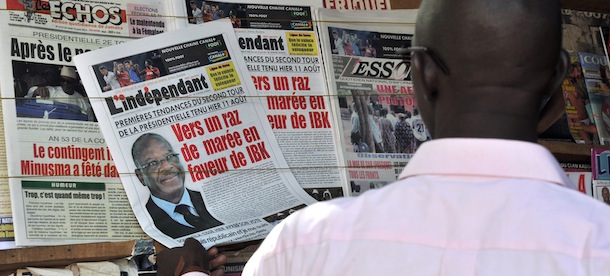 A man looks at newspapers on display at a newsstand on August 12, 2013, in Bamako, the day after the country's presidential election second round. An electorate of almost seven million had been asked Sunday to choose between former premier Ibrahim Boubacar Keita and ex-finance minister Soumaila Cisse to lead Mali's recovery, following last year's coup that ignited an Islamist insurgency and a French-led military intervention. Keita, 68, who is considered the favourite, was more than 20 percentage points ahead of his rival in the first round. AFP PHOTO / ISSOUF SANOGO (Photo credit should read ISSOUF SANOGO/AFP/Getty Images)