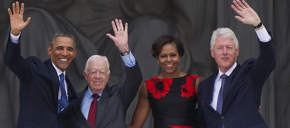 US President Barack Obama, First Lady Michelle Obama and former US Presidents Bill Clinton and Jimmy Carter wave during the Let Freedom Ring Commemoration and Call to Action to commemorate the 50th anniversary of the March on Washington for Jobs and Freedom at the Lincoln Memorial in Washington, DC on August 28, 2013. Thousands will gather on the mall on the anniversary of the march and Dr. Martin Luther King, Jr.'s famous "I Have a Dream" speech. AFP PHOTO / Saul LOEB (Photo credit should read SAUL LOEB/AFP/Getty Images)