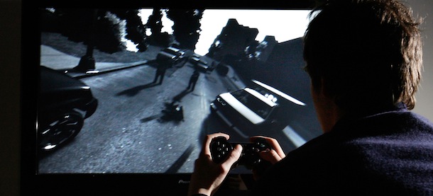 LONDON - APRIL 29: A young man plays Grand Theft Auto IV on the game's day of release on April 29, 2008 in London, England. The game designed for the Playstation 3 was in high demand and sold out in stores across London during its first day of sale. (Photo by Cate Gillon/Getty Images)