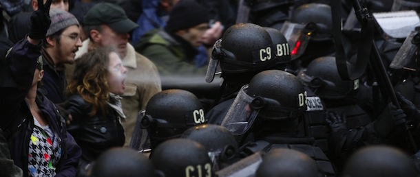 A police officer uses pepper spray on an Occupy Portland protestor at Pioneer Courthouse Square in Portland Ore., Thursday, Nov. 17, 2011. (AP Photo/The Oregonian, Randy L. Rasmussen) TV OUT