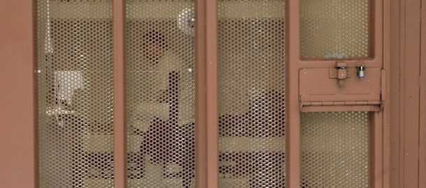 FILE -- In this Aug. 17, 2011 file photo, a pair of inmates are seen in their cell in the Secure Housing Unit at the Pelican Bay State Prison near Crescent City, Calif. California prison officials with the backing of a federal health care receiver are seeking court permission to force-feed inmates who have been participating in a hunger strike that is entering its seventh week. (AP Photo/Rich Pedroncelli,file)