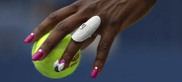 Venus Williams prepares to serve to Belgium's Kirsten Flipkens during the first round of the 2013 U.S. Open tennis tournament Monday, Aug. 26, 2013, in New York. (AP Photo/David Goldman)