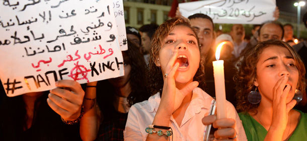 Protestors chant slogans during a demonstration on August 6, 2013 in Casablanca against the pardon by King Mohamed VI of Morocco to a Spanish paedofile who was arrested on August 5 by in Spain. A judge remanded in custody August 6th a convicted child rapist who was arrested in Spain after a controversial pardon by Morocco's king was revoked in the face of angry protests. The judge ruled that Daniel Galvan Vina, a Spanish national found guilty of raping 11 children aged between four and 15 in Morocco and sentenced to 30 years in prison there, was a flight risk and would remain in custody while his extradition was being considered, the court said. Galvan was arrested August 5th at a hotel in the southeastern Spanish city of Murcia where he once worked at a university after Morocco issued an international arrest warrant against him. AFP PHOTO / FADEL SENNA (Photo credit should read FADEL SENNA/AFP/Getty Images)