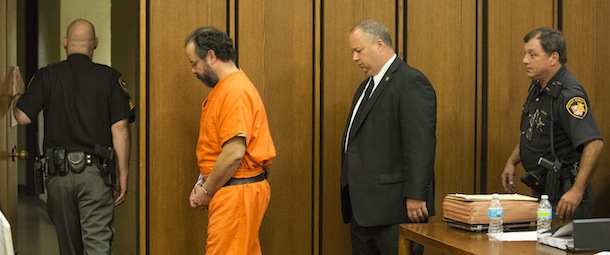 CLEVELAND, OH - AUGUST 1: Ariel Castro (2L) is led out of the courtroom after being sentenced to life without parole plus one thousand years on August 1, 2013 in Cleveland, Ohio. Castro was found guilty of abducting three women between 2002 and 2004 when they were between 14 and 21 years old. The women escaped this past May. (Photo by Angelo Merendino/Getty Images)