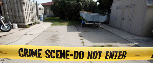 ROSEVILLE, MI, - SEPTEMBER 27: Crime scene tape marks off the site where a tipster reported to police that the body of former Teamster's union boss Jimmy Hoffa may be buried September 27, 2012 in Roseville, Michigan. Ground penetrating radar indicated there is an anomaly under the concrete and police officials are planning to bore there on Friday. The former Teamster's president disappeared from a restaurant parking lot in Bloomfield Township, Michigan in 1975. (Photo by Bill Pugliano/Getty Images)