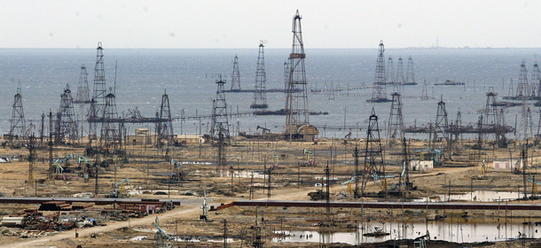 Oil derricks are seen near the Azerbaijani capital Baku, Wednesday Oct. 5, 2005. The mostly Muslim nation of 8.3 million is the starting point for Baku-Tbilisi-Ceyhan pipeline that will ship oil and gas from Azerbaijan's huge offshore reserves to a Turkish Mediterranean port. (AP Photo/Sergey Ponomarev)