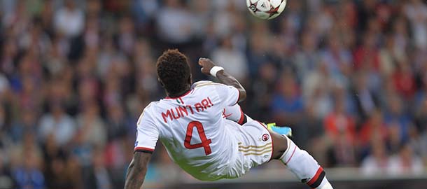 AC Milan's Sulley Muntari makes a play during their match against PSV Eindhoven in the Champions League play-offs first leg soccer match between PSV and AC Milan at the Philips stadium in Eindhoven, southern Netherlands, Tuesday, Aug. 20, 2013. (AP Photo/Ermindo Armino)
