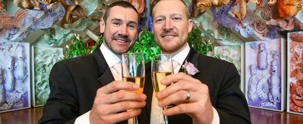 WELLINGTON, NEW ZEALAND - AUGUST 19: Paul McCarthy (L) and Trent Kandler pose after being married at the Museum of New Zealand, Te Papa, on August 19, 2013 in Wellington, New Zealand. Australian gay couple Paul McCarthy and Trent Kandler were flown to Wellington by Tourism New Zealand in a promotion to highlight to Australians that same-sex marriage is legal in New Zealand. (Photo by Hagen Hopkins/Getty Images)