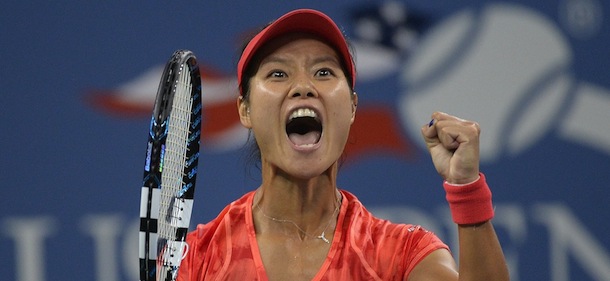China's Li Na celebrates defeating Serbia's Jelena Jankovic 6-3, 6-0 in a 2013 US Open women's fourth round singles match at the USTA Billie Jean King National Tennis Center in New York on September 1, 2013. AFP PHOTO/Emmanuel Dunand (Photo credit should read EMMANUEL DUNAND/AFP/Getty Images)
