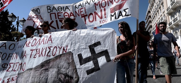 Greek students march outside the Parliament in Athens during an anti-fascism protest on September 25, 2013. Most of the country's mainstream parties called for a large turn-out in the early evening protests, which were sparked by the murder of an anti-fascist musician, allegedly at the hands of a self-confessed neo-Nazi last week. AFP PHOTO / ARIS MESSINIS (Photo credit should read ARIS MESSINIS/AFP/Getty Images)