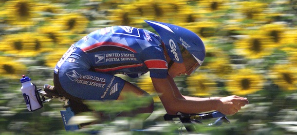 POITIERS, FRANCE: American Tyler Hamilton rides nearby a field of sunflowers during the 19th stage of the 86th Tour de France, an individual time-trial around the 'Futuroscope' in Poitiers, central France, 24 July 1999. Lance Armstrong won the stage. Hamilton finished 3rd. (ELECTRONIC IMAGE) (Photo credit should read JOEL SAGET/AFP/Getty Images)