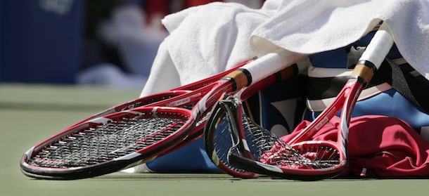 The broken racket of Stanislas Wawrinka, of Switzerland, sits with Wawrinka's belongings after he smashed it on the court during the semifinals against Novak Djokovic, of Serbia, at the 2013 U.S. Open tennis tournament, Saturday, Sept. 7, 2013, in New York. (AP Photo/Charles Krupa)