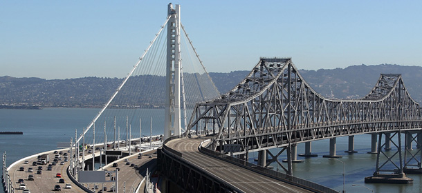 SAN FRANCISCO, CA - SEPTEMBER 03: Traffic flows across the new eastern span of the San Francisco Oakland Bay Bridge on the morning after the official opening of the bridge on September 3, 2013 in San Francisco, California. After nearly 12 years of construction and an estimated price tag of $6.4 billion, the new eastern span of the Bay Bridge opened to traffic a day ahead of schedule. The bridge is the world's tallest Self-Anchored Suspension (SAS) tower. (Photo by Justin Sullivan/Getty Images)