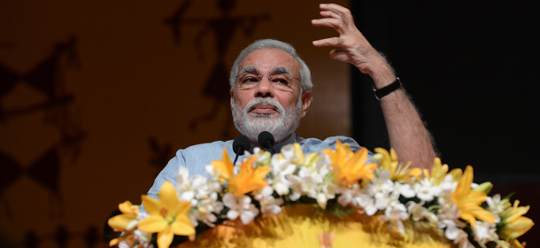 Gujarat state Chief Minister Narendra Modi speaks during the Vibrant Gujarat 2013, Global Agriculture summit at Mahatma Mandir in Gandhinagar, some 30 kms from Ahmedabad on September 9, 2013. Modi said that some 2500 farmers leave farming daily, some 2,70,000 farmers have commited suicide in last 20 years and some 20% of farm products are lost owing to lack of sufficient and proper warehouses and storage facilities. AFP PHOTO / Sam PANTHAKY (Photo credit should read SAM PANTHAKY/AFP/Getty Images)