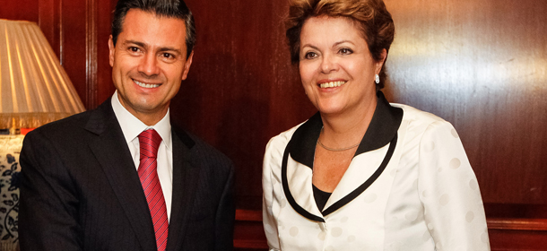 In this photo relased by the Brazilian Presidency, Brazil's President Dilma Rousseff, right, poses for a photo with Mexico's President Enrique Pena Nieto during a bilateral meeting in Santiago, Chile, Saturday, Jan. 26, 2013. Leaders from the European Union, Latin America and the Caribbean have gathered in Santiago for CELAC-EU; a 60-nation, two day economic summit. (AP Photo/Brazilian Presidency, Robert Stuckert Filho)