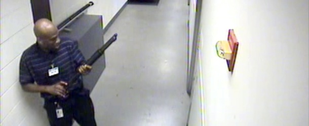This image from video provided by the FBI, shows Aaron Alexis moves through the hallways of Building #197 at the Washington Navy Yard on Monday, Sept. 16, 2013, in Washington, carrying a Remington 870 shotgun. Alexis, a 34-year-old former Navy reservist and IT contractor, shot and killed 12 people inside a Navy Yard building last week before being killed in a shootout with police. (AP Photo/FBI)