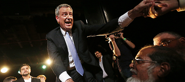 NEW YORK, NY - SEPTEMBER 11: Democratic candidate for Mayor Bill de Blasio (C) greets well wishers at his primary night party on September 11, 2013 in the Brooklyn borough of New York City. De Blasio is leading the Democratic race, according to exit polls. (Photo by Mario Tama/Getty Images)